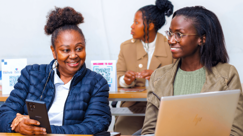 Twiva Academy lead Wangari (right) conversing with ISA CEO Susan Mukau at the Twiva x ISA Campus Activation at UoN